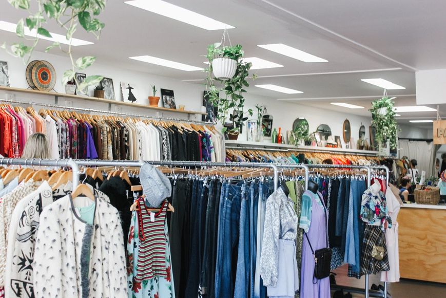 a wholesale clothing vendor with clothes displayed in hangers