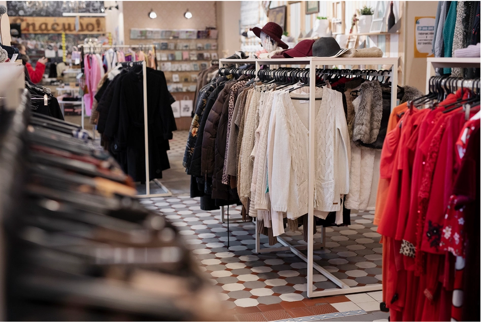 a clothing rack with wholesale clothes on swingers in a boutique