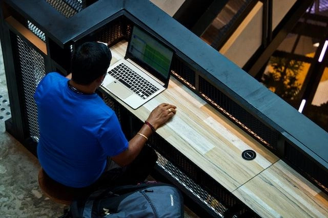 A Man Using Spreadsheet to Keep Track of Products’ Details