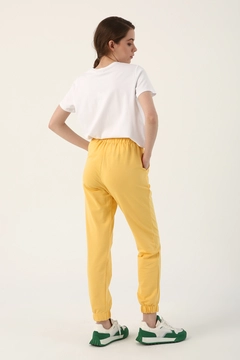 A wholesale clothing model wears all12841-light-jogger-sweatpants-yellow, Turkish wholesale Sweatpants of Allday