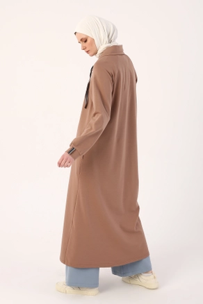A model wears 7910 - Modest Abaya - Earth Color, wholesale Abaya of Allday to display at Lonca