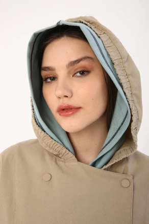 A model wears 9596 - Modest Coat - Beige, wholesale Coat of Allday to display at Lonca