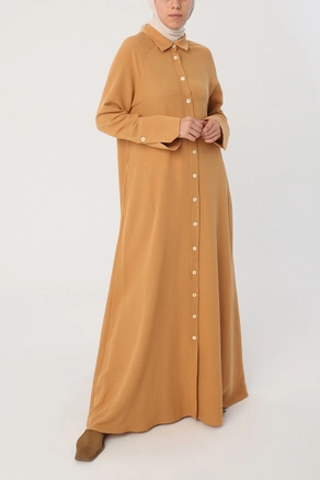 A model wears 28345 - Abaya - Mustard, wholesale undefined of Allday to display at Lonca