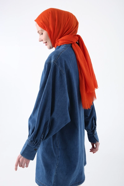 A model wears ALL10718 - Bamboo Knee Shawl - Orange, wholesale Shawl of Allday to display at Lonca