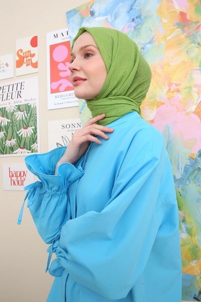 A model wears ALL10719 - Pistachio Bamboo Knee Shawl - Pistachio Green, wholesale Shawl of Allday to display at Lonca