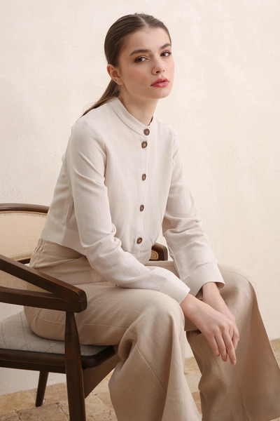 A model wears ALL10827 - Stone Collar Buttoned Cotton Linen Short Jacket - Stone, wholesale Jacket of Allday to display at Lonca