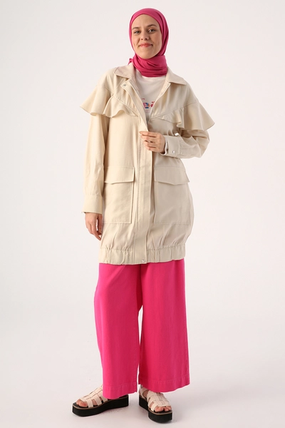 A model wears ALL10297 - Zippered Cap - Stone Color, wholesale Coat of Allday to display at Lonca