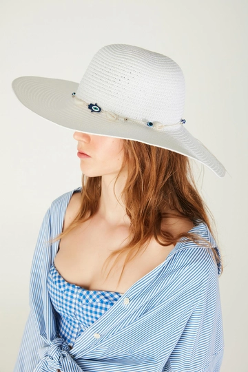 A wholesale clothing model wears  Wide Straw Hat With Evil Eye Beads And Conch - White
, Turkish wholesale Hat of Axesoire