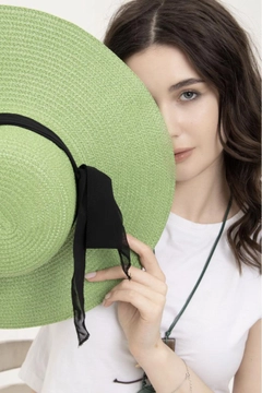 A wholesale clothing model wears axs10988-wide-straw-hat-with-bow-detail-green, Turkish wholesale Hat of Axesoire