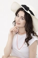 A wholesale clothing model wears axs10915-wide-straw-hat-with-bow-detail-ecru, Turkish wholesale  of 