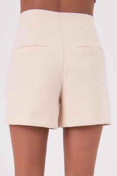 A wholesale clothing model wears bsl10250-high-waist-mini-short, Turkish wholesale Shorts of BSL