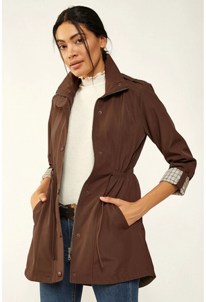 A model wears 12595 - Trenchcoat - Cappuccino, wholesale undefined of Big Merter to display at Lonca