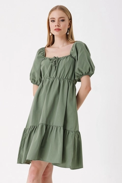 A wholesale clothing model wears big10820-flared-poplin-dress-khaki, Turkish wholesale Dress of Bigdart