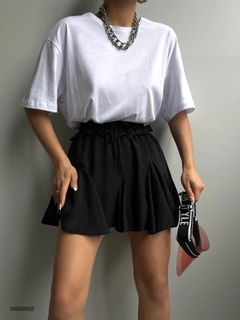A wholesale clothing model wears BLA10737 - Pleated Mini Skirt - Black, Turkish wholesale Skirt of Black Fashion