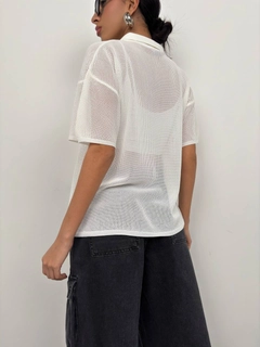 A wholesale clothing model wears bla11494-polo-neck-transparent-ecru, Turkish wholesale Tshirt of Black Fashion