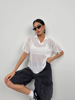 A wholesale clothing model wears bla11494-polo-neck-transparent-ecru, Turkish wholesale Tshirt of Black Fashion