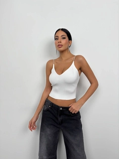 A wholesale clothing model wears bla11501-stone-strap-knitted-blouse-ecru, Turkish wholesale Crop Top of Black Fashion