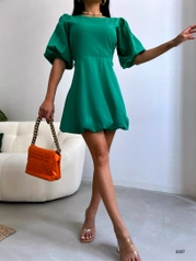 A model wears 38393 - Dress - Green, wholesale undefined of Black Fashion to display at Lonca