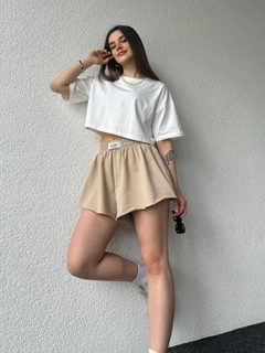 A wholesale clothing model wears cap10482-labeled-shorts-sand-beige, Turkish wholesale Shorts of CAPPITONE