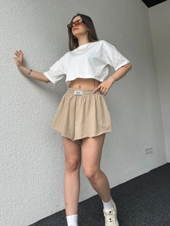 A wholesale clothing model wears cap10482-labeled-shorts-sand-beige, Turkish wholesale Shorts of CAPPITONE