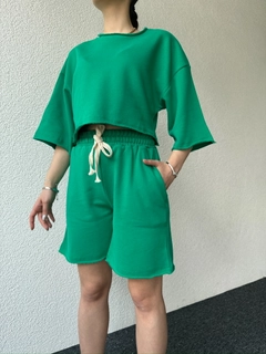 A wholesale clothing model wears cap10475-dirty-stitched-plain-shorts-set-green, Turkish wholesale Suit of CAPPITONE