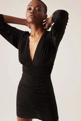A model wears 44056 - Dress - Black, wholesale undefined of Cream Rouge to display at Lonca