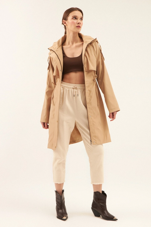 A model wears 44083 - Raincoat - Coffee With Milk, wholesale Raincoat of Cream Rouge to display at Lonca