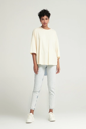A model wears 48129 - T-shirt - Cream, wholesale Tshirt of Cream Rouge to display at Lonca