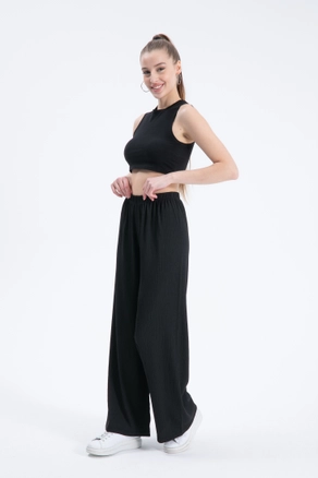 A model wears CRO10050 - Trousers - Black, wholesale undefined of Cream Rouge to display at Lonca