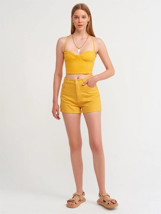 A model wears 16486 - Shorts - Orange, wholesale Shorts of Dilvin to display at Lonca