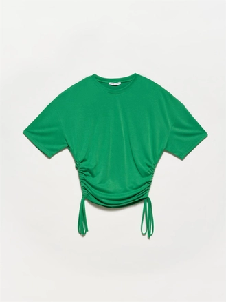 A model wears 17396 - Tshirt - Green, wholesale Tshirt of Dilvin to display at Lonca