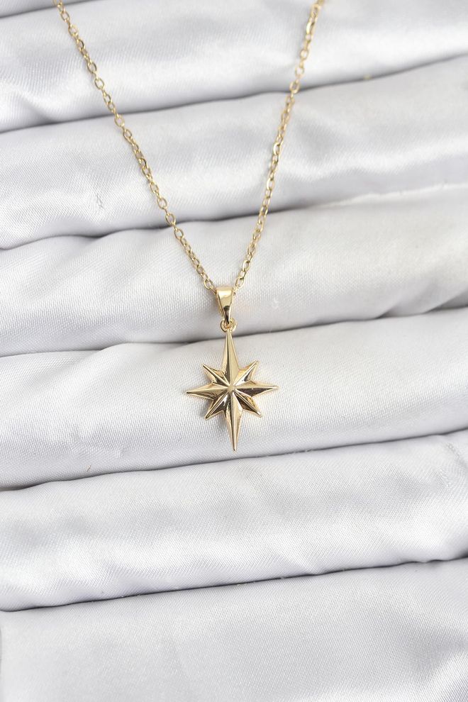 Ebijuteri قلادة نسائية من سلسلة فولاذية 316l باللون الذهبي على شكل نجمة ملابس بالجملة 0
