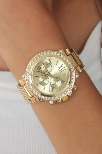 Een kledingmodel uit de groothandel draagt  Horloge - Goud
, Turkse groothandel Horloge van Ebijuteri