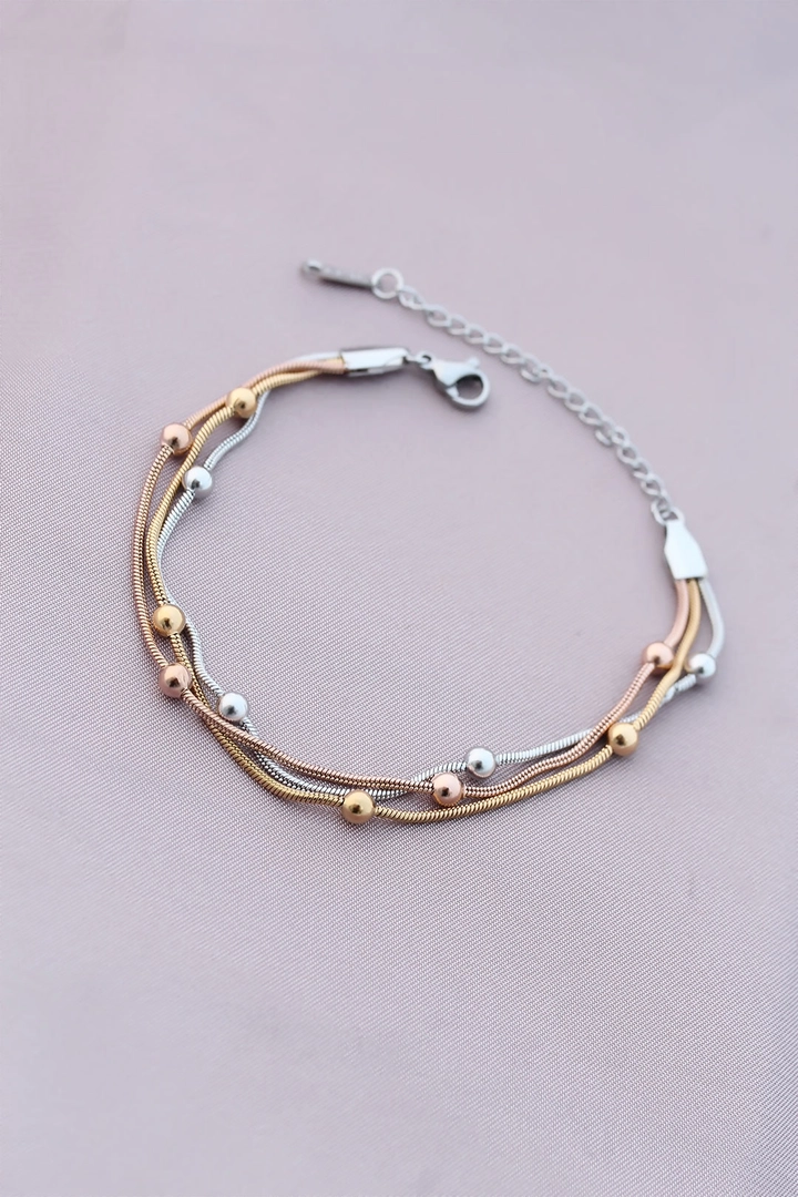 A wholesale clothing model wears 20925 - Steel Bracelet - Gold Silver Rose, Turkish wholesale Bracelet of Ebijuteri