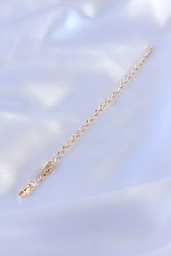 A wholesale clothing model wears EBJ10685 - 316L Steel Gold Color Barley Zircon Stone Waterway Women's Bracelet, Turkish wholesale Bracelet of Ebijuteri