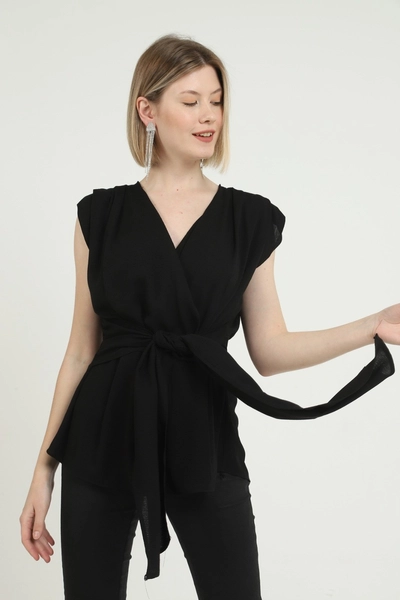 A model wears ELS10050 - Belted Zero Sleeve Waistband Blouse - Black, wholesale Blouse of Elisa to display at Lonca