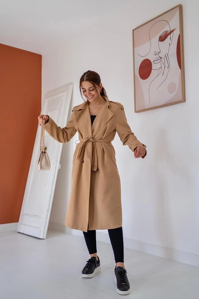 A model wears ELS10064 - Belted And Buttoned Trench Coat - Camel, wholesale Trenchcoat of Elisa to display at Lonca