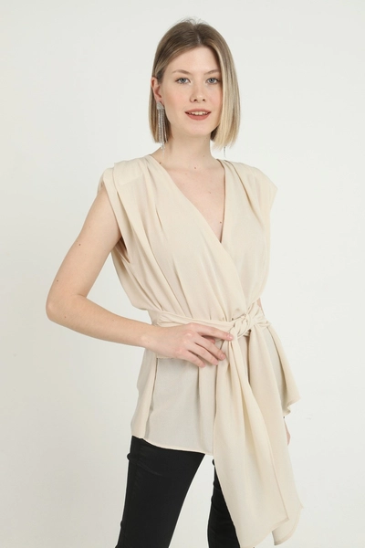 A model wears ELS10096 - Belted Zero Sleeve Waistband Blouse - Beige, wholesale Blouse of Elisa to display at Lonca