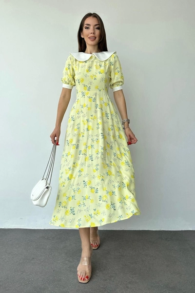 A model wears ELS10113 - Bib Collar Floral Pattern Dress - Yellow, wholesale Dress of Elisa to display at Lonca