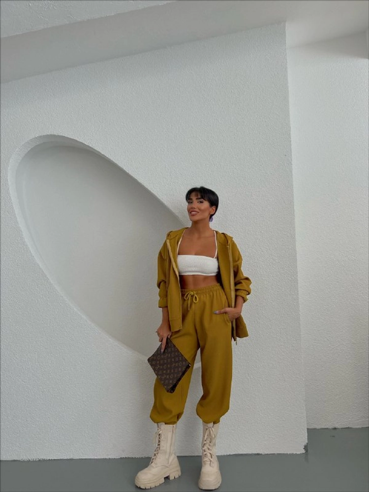 A model wears 28453 - Tracksuit - Olive Green, wholesale Tracksuit of Ello to display at Lonca