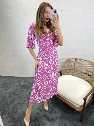 A model wears FME10219 - Dress - Fuchsia, wholesale Dress of Fame to display at Lonca