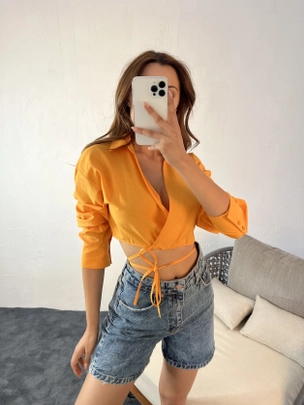 A model wears 16730 - Crop Top - Orange, wholesale undefined of Fame to display at Lonca