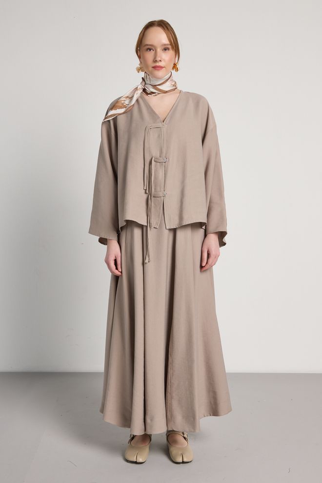 First Angels Blouson Beige Enveloppant Avec Col En V Vêtements en gros Modeste