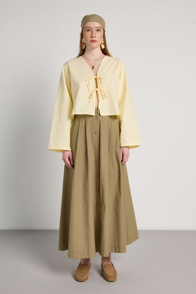 First Angels جيبة كاكي مكسي عالية الخصر متوهجة بأزرار أنيقة ملابس بالجملة محتشم