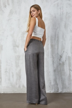 A wholesale clothing model wears fan10308-anthracite-crinkle-lurex-loose-cut-trousers, Turkish wholesale Pants of First Angels