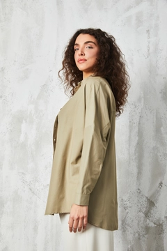 A wholesale clothing model wears fan10384-khaki-oversize-poplin-shirt, Turkish wholesale Shirt of First Angels