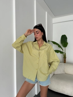A wholesale clothing model wears fan10473-oil-green-white-striped-oversize-pocket-shirt, Turkish wholesale Shirt of First Angels