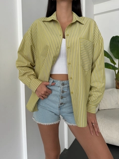 A wholesale clothing model wears fan10473-oil-green-white-striped-oversize-pocket-shirt, Turkish wholesale Shirt of First Angels