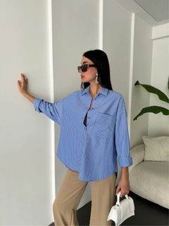 A wholesale clothing model wears fan10475-blue-white-striped-oversize-pocket-shirt-27135, Turkish wholesale Shirt of First Angels