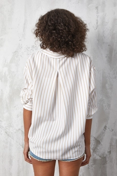 A wholesale clothing model wears fan10494-beige-stripe-printed-oversize-pocket-shirt, Turkish wholesale Shirt of First Angels